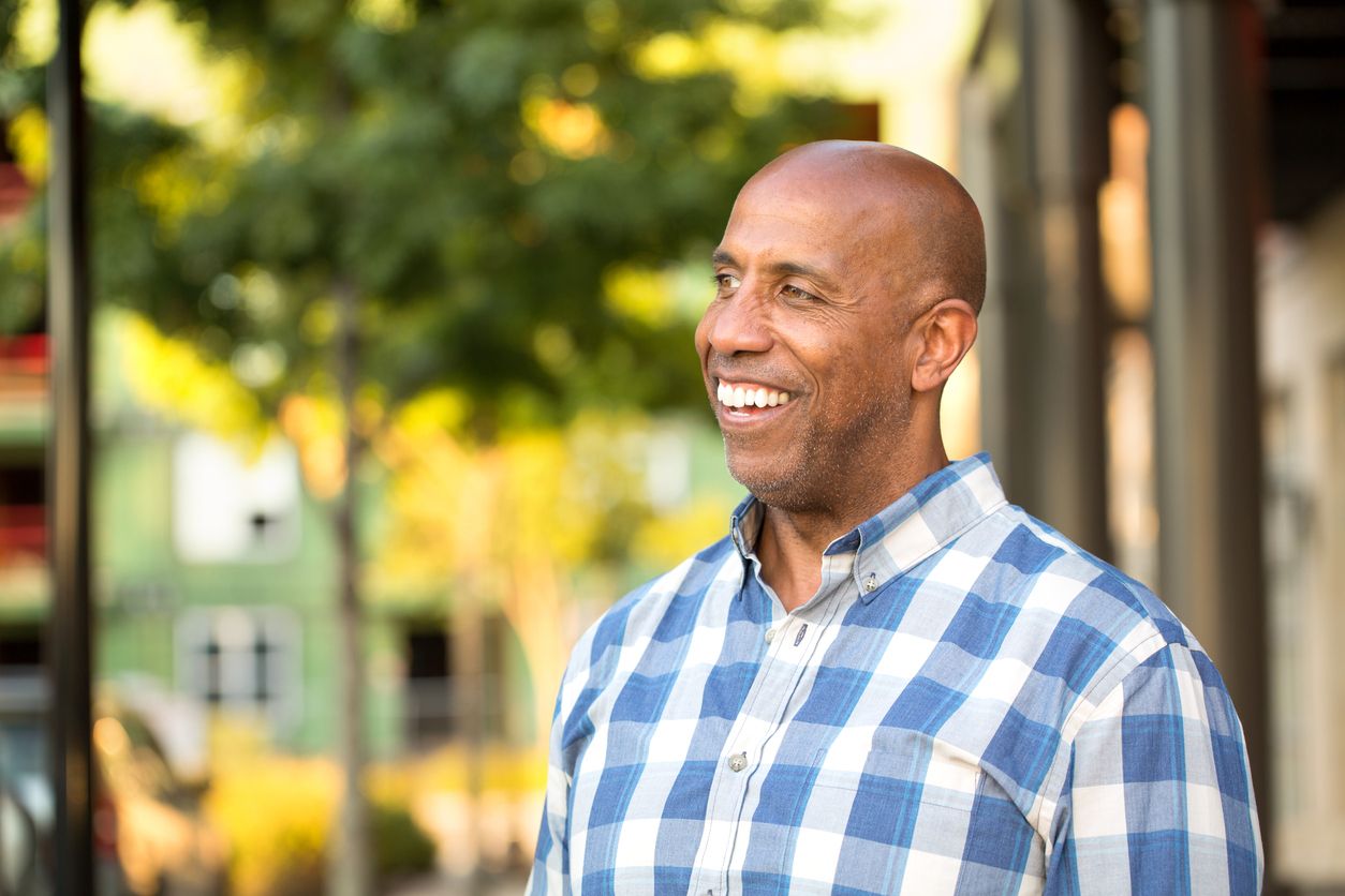 Portrait of a mature African American man smiling.